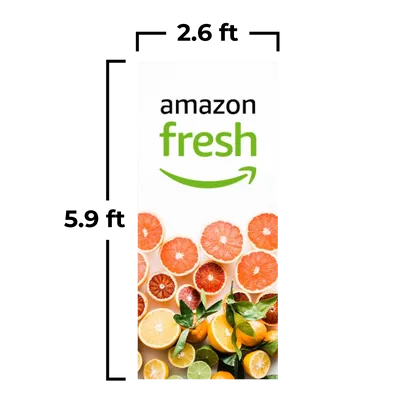 79 x 180 cm An advertising banner for 'Amazon Fresh' features a logo at the top and a vibrant selection of citrus fruit slices beneath it.